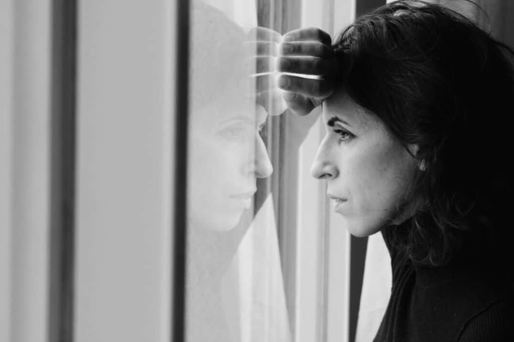 Woman looking out of a window